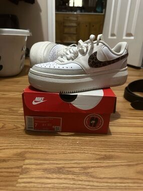 Nike Kids White Platform Sneakers with Leopard Swoosh Accent